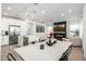 Stylish kitchen and living area with modern lighting, fireplace and stainless steel appliances at 4077 S Sabrina Dr # 14, Chandler, AZ 85248