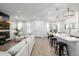 Bright, open-concept living space with wood floors, white walls, and modern decor at 4077 S Sabrina Dr # 14, Chandler, AZ 85248