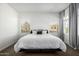 Clean and bright main bedroom with a comfortable bed and serene window views at 4077 S Sabrina Dr # 14, Chandler, AZ 85248