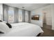 Comfortable bedroom features soft bedding, natural light and a wall-mounted television at 4077 S Sabrina Dr # 14, Chandler, AZ 85248