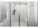 This walk-in shower features white subway tile surround, a bench, a hand held shower and glass enclosure at 4077 S Sabrina Dr # 14, Chandler, AZ 85248