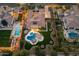 An aerial view showcases this home's backyard with a private pool, lush landscaping, and an outdoor entertaining space at 4547 S Banning Dr, Gilbert, AZ 85297