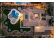 Aerial view of a stunning home showcasing a private backyard pool, lush landscaping, and a spacious patio area at 4547 S Banning Dr, Gilbert, AZ 85297