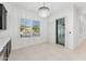 The dining area includes decorative lighting and a sliding door leading to the backyard at 4547 S Banning Dr, Gilbert, AZ 85297