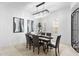 Beautiful dining room with stylish seating and modern decor with a view to the gated entry at 4547 S Banning Dr, Gilbert, AZ 85297