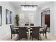 Well-lit dining room featuring an elegant chandelier, and modern decor at 4547 S Banning Dr, Gilbert, AZ 85297