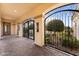 Ornate gated entrance to a courtyard with covered entry and door at 4547 S Banning Dr, Gilbert, AZ 85297