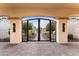 Ornate gated entrance to a courtyard with beautiful plants and design at 4547 S Banning Dr, Gilbert, AZ 85297