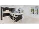 Modern kitchen with dark cabinets, large marble island with bar seating, and stainless steel appliances at 4547 S Banning Dr, Gilbert, AZ 85297