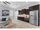 Modern kitchen featuring dark cabinets, stainless steel appliances and stylish decor at 4547 S Banning Dr, Gilbert, AZ 85297