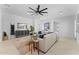 Comfortable living room featuring neutral colors, a modern ceiling fan and well-lit at 4547 S Banning Dr, Gilbert, AZ 85297