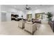 Open-concept living area featuring tile floors and a seamless transition to the modern kitchen space at 4547 S Banning Dr, Gilbert, AZ 85297