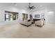 Bright living room with neutral tones, large windows and a view of the backyard pool at 4547 S Banning Dr, Gilbert, AZ 85297