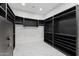 Large walk-in closet with custom shelving and secure Liberty safe for maximum storage at 4547 S Banning Dr, Gilbert, AZ 85297