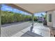 Covered back patio with brick flooring, a BBQ, and string lights offers an outdoor living space at 515 W Smoke Tree Rd, Gilbert, AZ 85233