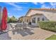Spacious brick patio with outdoor seating and a covered area provides a relaxing backyard retreat at 515 W Smoke Tree Rd, Gilbert, AZ 85233