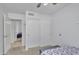 Bedroom with large closet with bi-fold doors and attached bathroom at 515 W Smoke Tree Rd, Gilbert, AZ 85233