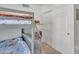 Bright bedroom featuring a bunk bed with storage steps and a closet, maximizing space and functionality at 515 W Smoke Tree Rd, Gilbert, AZ 85233