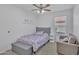 Comfortable bedroom with a twin bed, chair, and window view at 515 W Smoke Tree Rd, Gilbert, AZ 85233