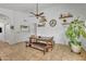 Cozy dining area featuring rustic table, bench seating, and decorative shelving at 515 W Smoke Tree Rd, Gilbert, AZ 85233