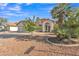 Attractive single-story home with desert landscaping, tile roof and inviting front entrance at 515 W Smoke Tree Rd, Gilbert, AZ 85233