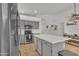 Modern kitchen with gray cabinets, quartz countertops, and stainless steel appliances at 515 W Smoke Tree Rd, Gilbert, AZ 85233
