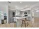 Modern kitchen with stainless steel appliances, gray cabinetry, quartz countertops and kitchen island at 515 W Smoke Tree Rd, Gilbert, AZ 85233