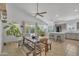 Open-concept living space with dining area, kitchen, and ample natural light at 515 W Smoke Tree Rd, Gilbert, AZ 85233