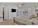 Comfortable main bedroom with large window, ceiling fan, and ample closet space at 515 W Smoke Tree Rd, Gilbert, AZ 85233