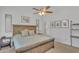Comfortable main bedroom with large bed, wood accents, and neutral carpet at 515 W Smoke Tree Rd, Gilbert, AZ 85233