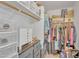 Organized walk-in closet with shelving, drawers, and hanging space at 515 W Smoke Tree Rd, Gilbert, AZ 85233