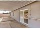 Covered back patio with sliding glass door entry into the home at 5423 S Palm Dr, Tempe, AZ 85283