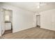 Spacious bedroom featuring neutral carpet, white walls, and several doors at 5423 S Palm Dr, Tempe, AZ 85283
