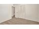 Bedroom with neutral carpet, white walls, closet, and ensuite bathroom access at 5423 S Palm Dr, Tempe, AZ 85283