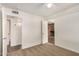 Bedroom featuring carpet, white walls, with doors leading to the bathroom and a brick fireplace at 5423 S Palm Dr, Tempe, AZ 85283