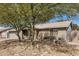 Brick single-story house with desert landscaping and mature trees at 5423 S Palm Dr, Tempe, AZ 85283