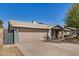 Single-story home with a two-car garage and an extended driveway for additional parking at 5423 S Palm Dr, Tempe, AZ 85283