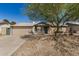 Charming single-story home with a well-maintained lawn, brick facade, and a two-car garage at 5423 S Palm Dr, Tempe, AZ 85283