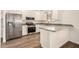 Well-lit kitchen with stainless steel appliances and modern gray countertops at 5423 S Palm Dr, Tempe, AZ 85283
