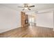 Large living room featuring a brick fireplace and stylish flooring at 5423 S Palm Dr, Tempe, AZ 85283