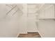 Empty walk-in closet featuring white wire and plank shelving at 5423 S Palm Dr, Tempe, AZ 85283