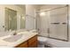 This bathroom features a shower and bathtub combo and a vanity with cabinet storage at 5808 E Brown Rd # 119, Mesa, AZ 85205