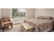 This bedroom provides great natural lighting and comfortable seating with a nearby window at 5808 E Brown Rd # 119, Mesa, AZ 85205