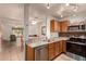 Well-lit kitchen with stainless steel appliances, granite countertops, and open to the dining area at 5808 E Brown Rd # 119, Mesa, AZ 85205