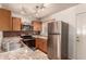 Modern kitchen with stainless steel appliances and granite countertops at 5808 E Brown Rd # 119, Mesa, AZ 85205