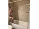 Cozy bathroom features bathtub and decorative tile at 5916 W Coronado Rd, Phoenix, AZ 85035