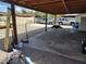 An open carport provides sheltered parking with a wooden support structure and ample space at 5916 W Coronado Rd, Phoenix, AZ 85035