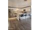 Bright kitchen features white cabinets, stainless appliances, and center island with bar seating at 5916 W Coronado Rd, Phoenix, AZ 85035