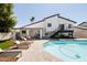Stunning backyard with a pool, lounge chairs, and a modern home exterior perfect for outdoor relaxation at 6174 E Janice Way, Scottsdale, AZ 85254
