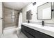 Well-appointed bathroom showcasing a double vanity, modern fixtures, and a shower-tub combination at 6174 E Janice Way, Scottsdale, AZ 85254